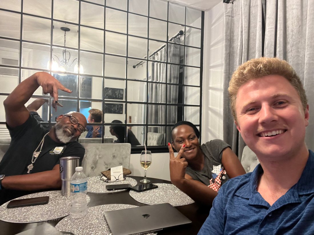 Conner Leeb with homeowners in their dining room