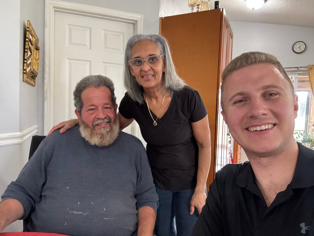 Conner Leeb with a couple at their home