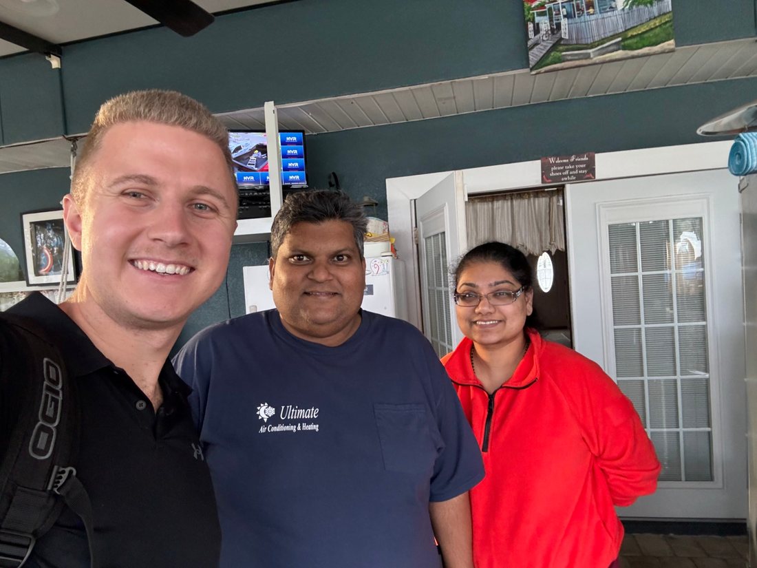Conner Leeb with homeowners in their sunroom