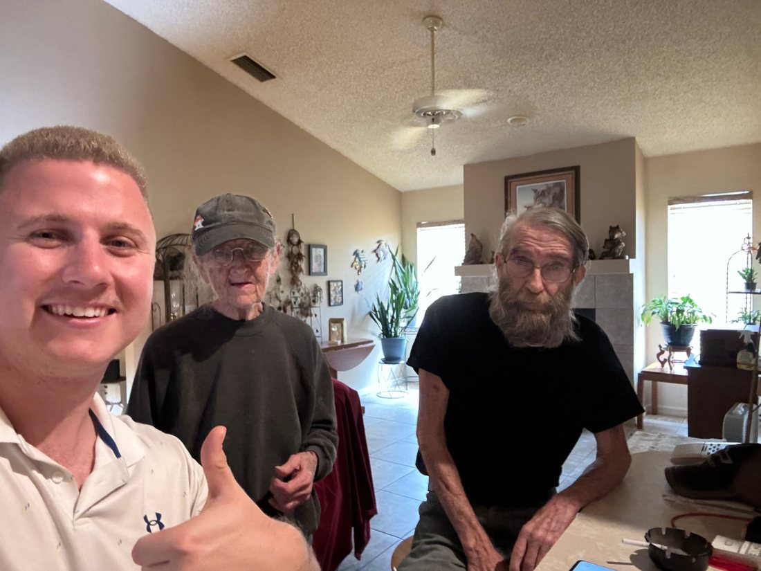Conner Leeb with homeowners in their living room
