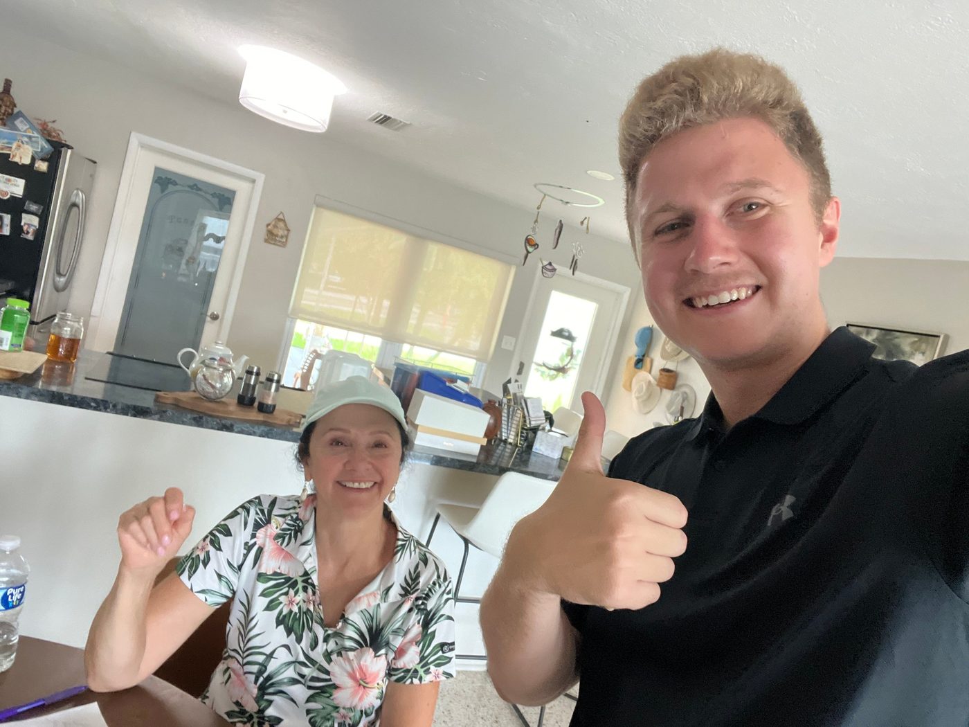 Conner Leeb with a homeowner in her kitchen
