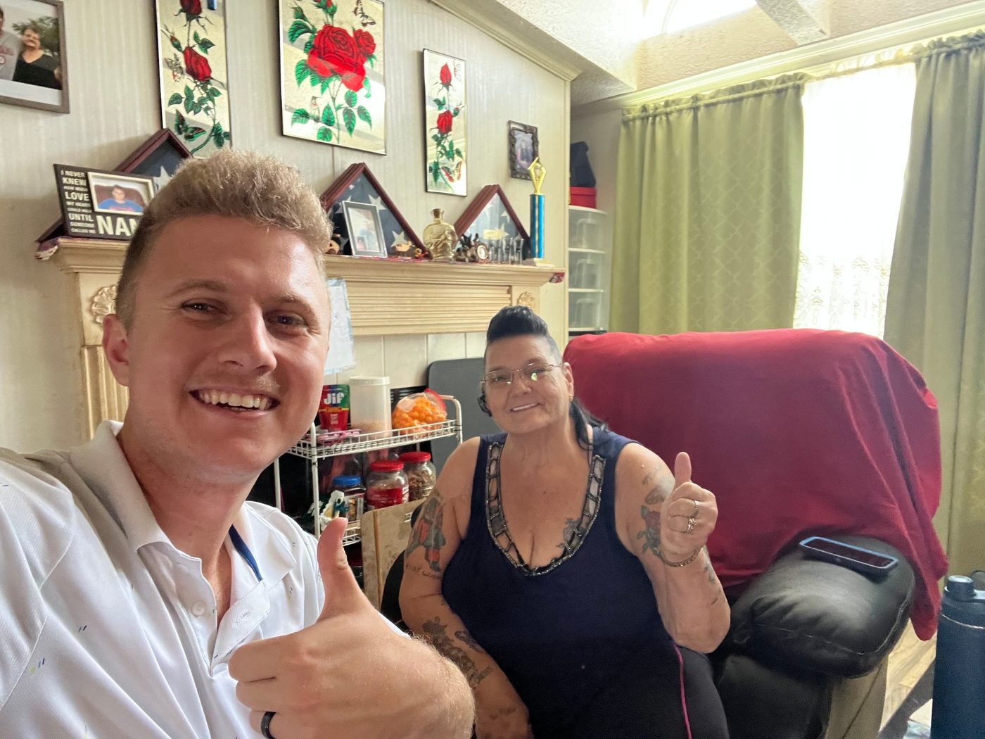 Conner Leeb with a homeowner in her living room