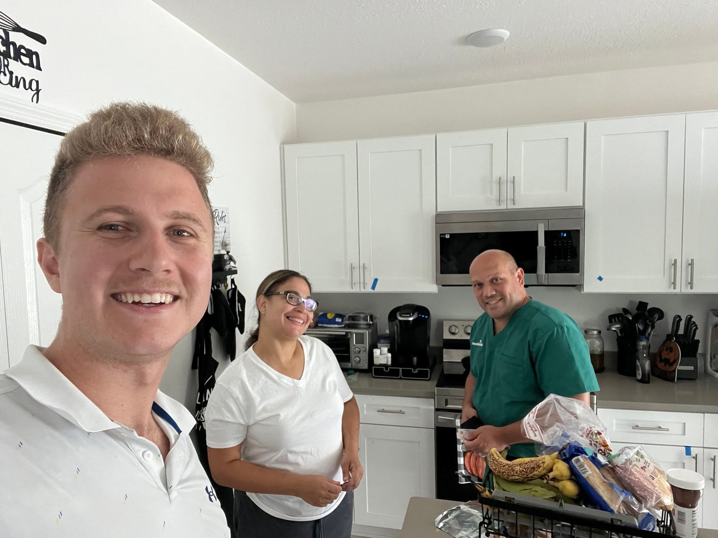 Conner Leeb with a couple at their kitchen counter