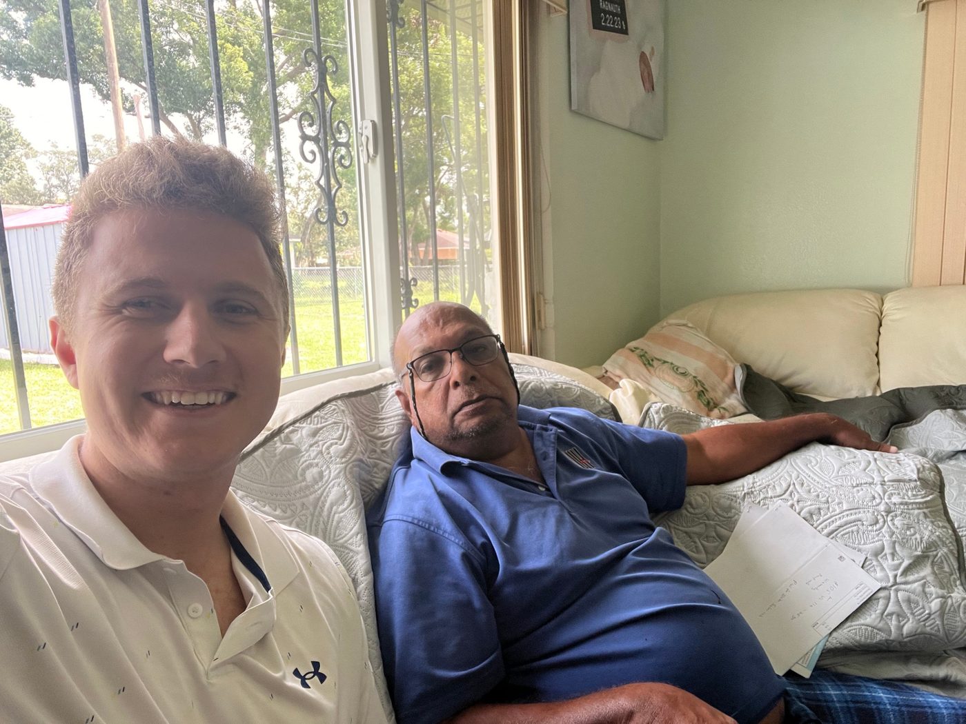 Conner Leeb with a homeowner on his couch