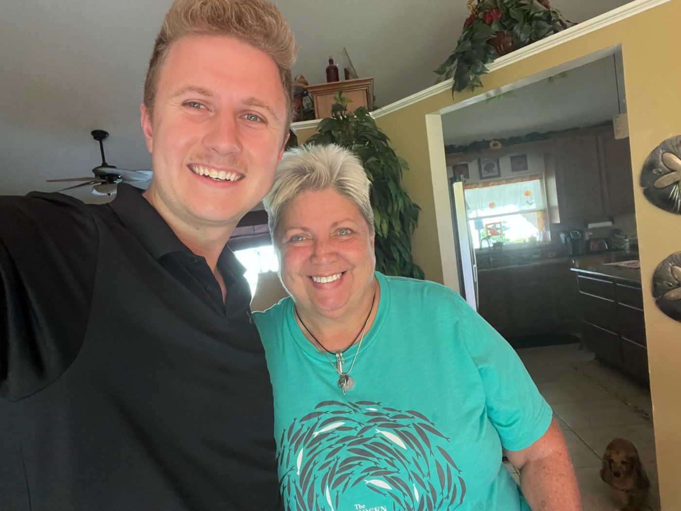 Conner Leeb with a homeowner at her home