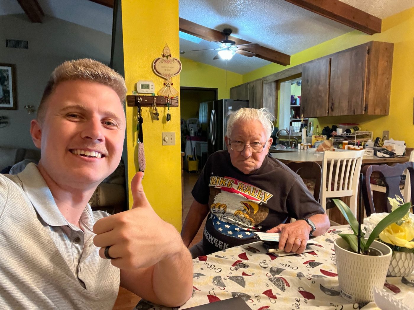 Conner Leeb with a homeowner at his dining table