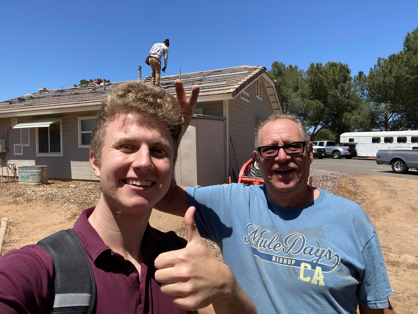 Conner Leeb with a homeowner during a rooftop installation