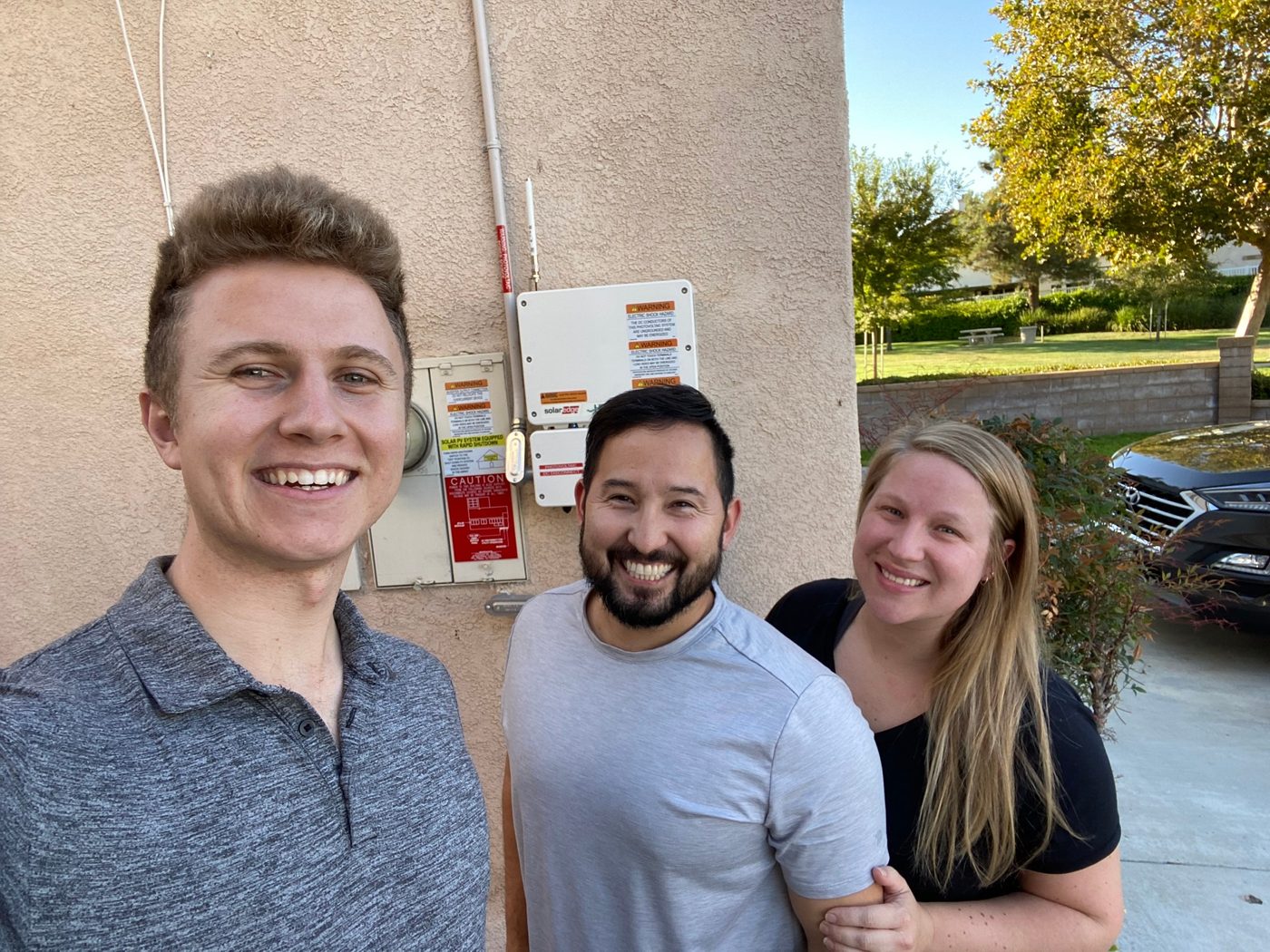 Conner Leeb with a couple in front of their new inverter